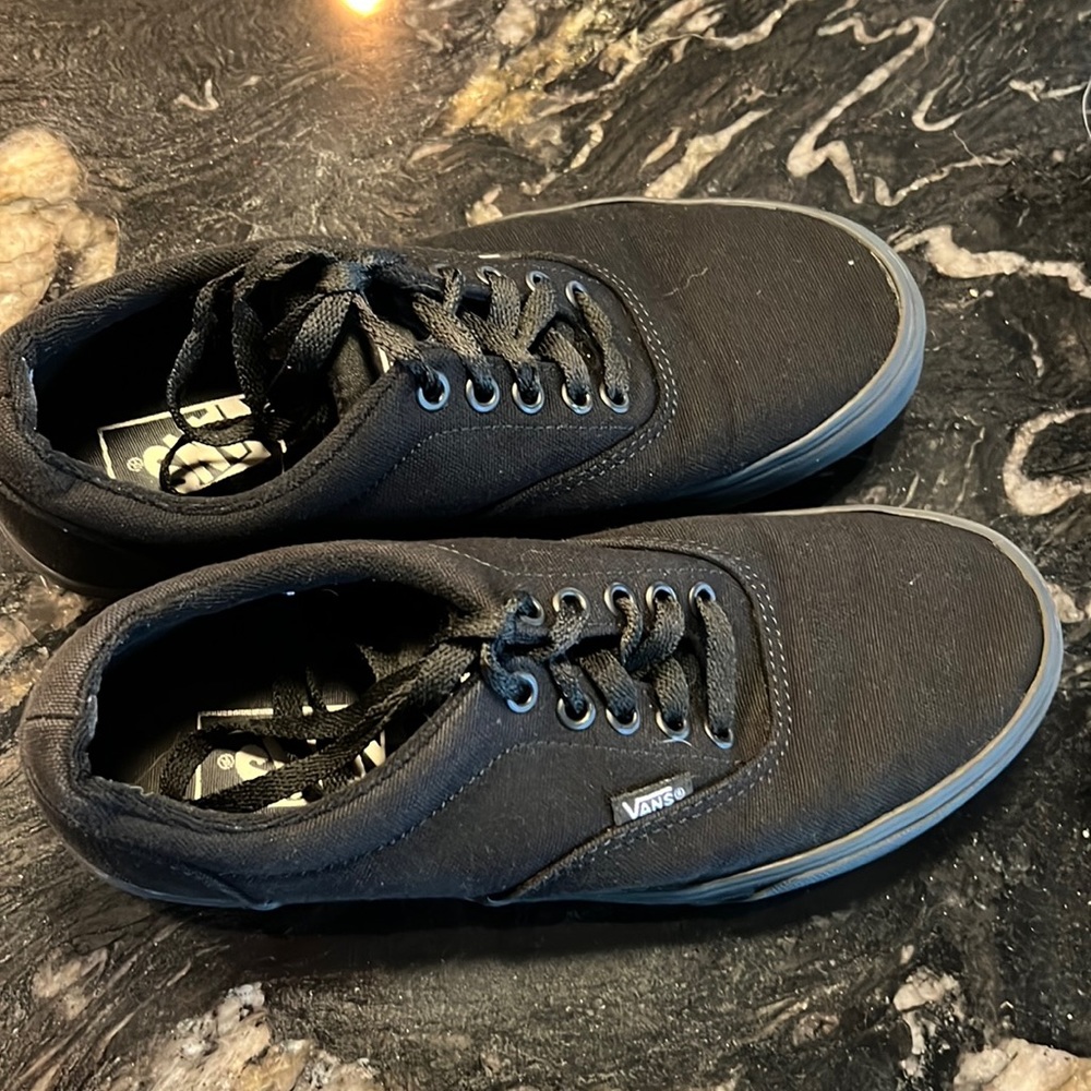 All black Vans sneakers with laces. Size 7 mens